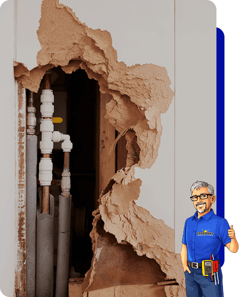 Large hole in drywall exposes pipes and valves; a cartoon climatemakers technician in a blue uniform stands in the lower right corner.