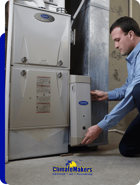 A man adjusts a humidity control device on an indoor HVAC system; the climatemakers logo appears at the bottom of the image.